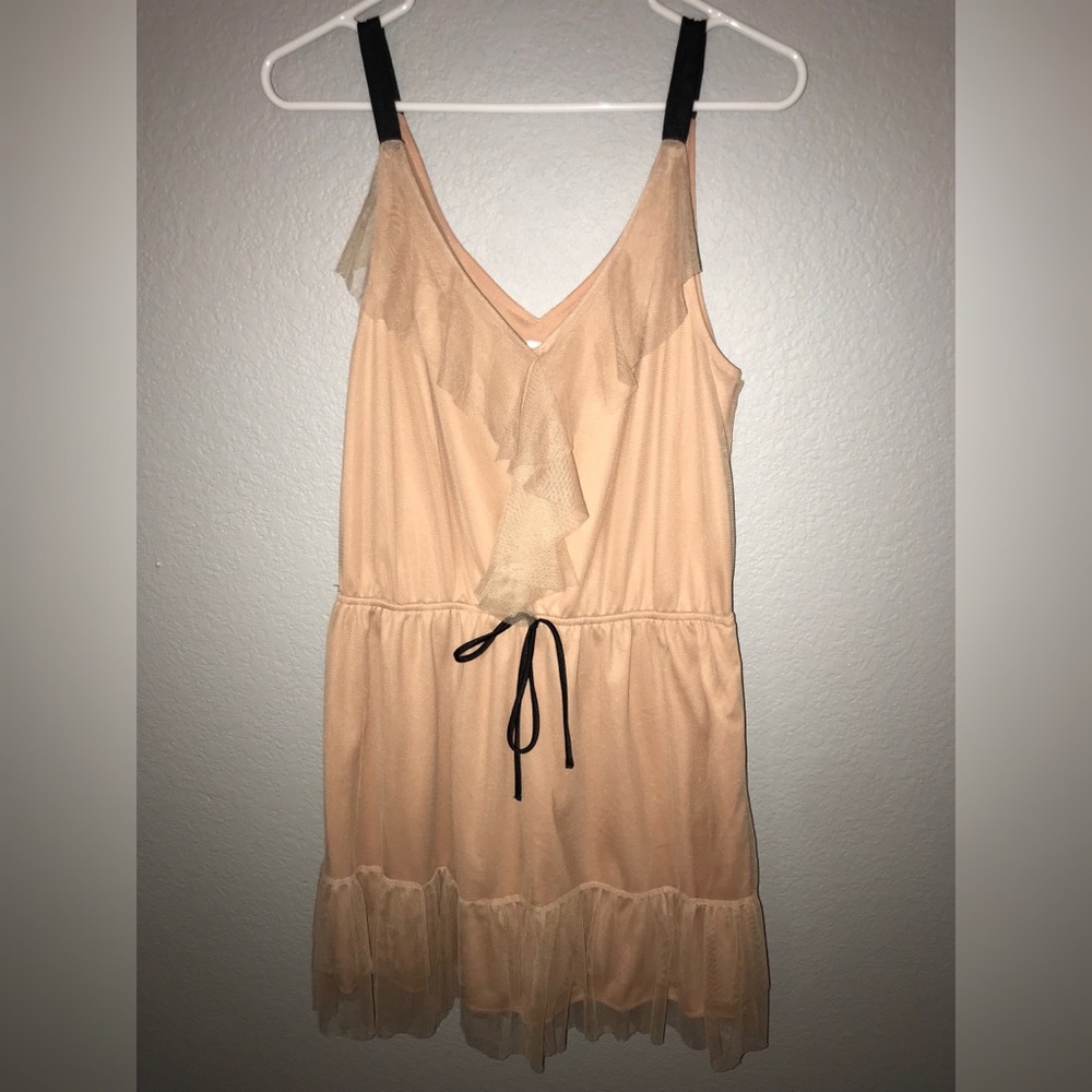 Peach colored sundress with mesh, lace accents.